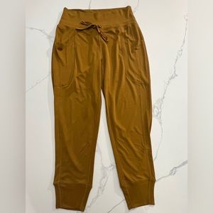 NWOT FABLETICS mustard yellow joggers with pockets size small